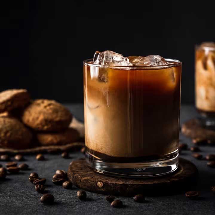 EDGAR'S TWISTED BRANDY MILK PUNCH - Equal parts Kentucky Bourbon meets with French Brandy and is mixed with vanilla cream, milk syrup, and half and half. Topped with star anise.
